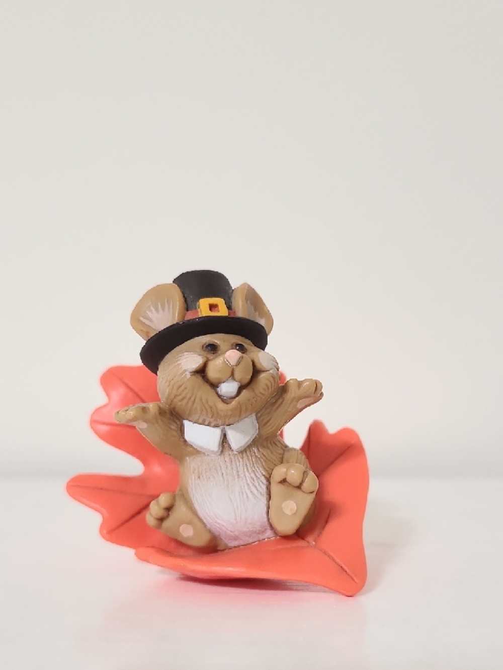 1982 Hallmark Merry Miniature figurine titled "Pilgrim Mouse on Orange Leaf"